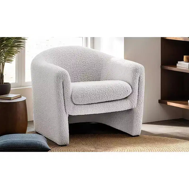 Fauteuil d'appoint en bouclette de forme incurvée avec accoudoirs arrondis